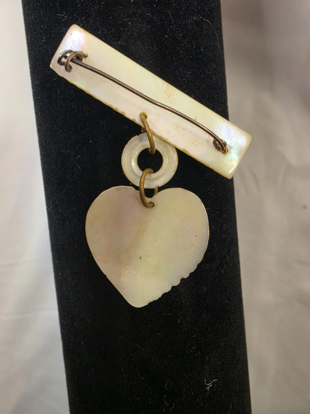Vintage World War II-era U.S. Navy sweetheart brooch, made from carved MOP